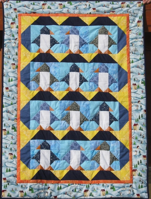 coperta con pinguini ricamata